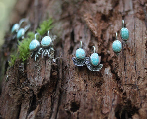 Earrings on moss
